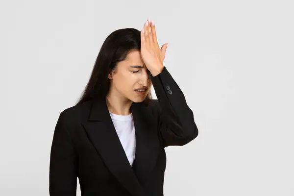 Businesswoman Black Suit Looking Stressed Regretful Her Hand Her Forehead — Stock Photo, Image