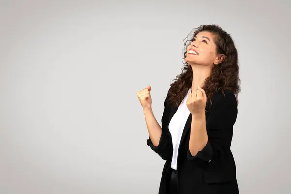 Elated Young European Businesswoman Beaming Smile Looks Raising Her Fists — Stock Photo, Image