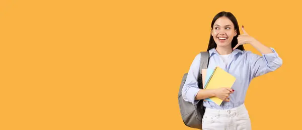 Smiling Female Student Backpack Holding Notebooks Making Call Hand Gesture — Stock Photo, Image