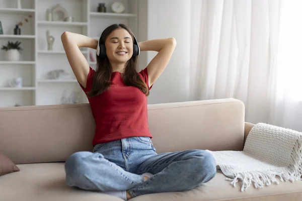 Content Asian Woman Listening Music Wireless Headphones Home Happy Korean — Stock Photo, Image