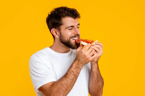 Portrait Young European Guy Holds Savors Tasty Pizza Slice Posing — Stock Photo, Image