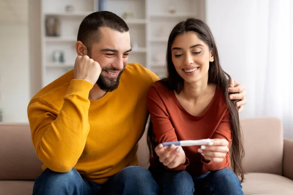 Portrait Happy Young Couple Looking Positive Pregnancy Test While Sitting — Stock Photo, Image