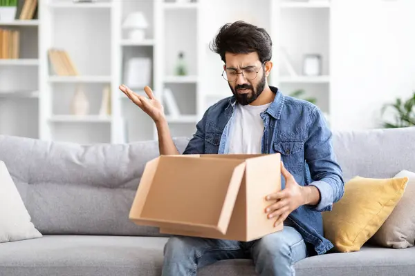 Wrong Delivery Perplexed Young Indian Man Holding Open Empty Cardboard — Stock Photo, Image