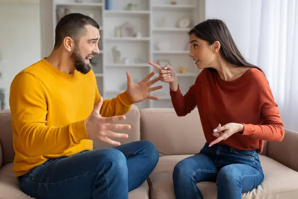 Domestic Conflicts Portrait Young Caucasian Couple Arguing Home Emotional Spouses — Stock Photo, Image