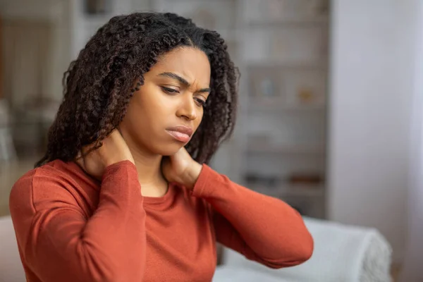 Young Black Female Suffering Neck Pain While Sitting Couch Home — Stock Photo, Image