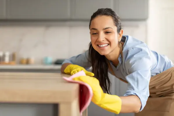 Radiant Young Woman Blue Shirt Yellow Gloves Wiping Dust Wooden — Stock Photo, Image