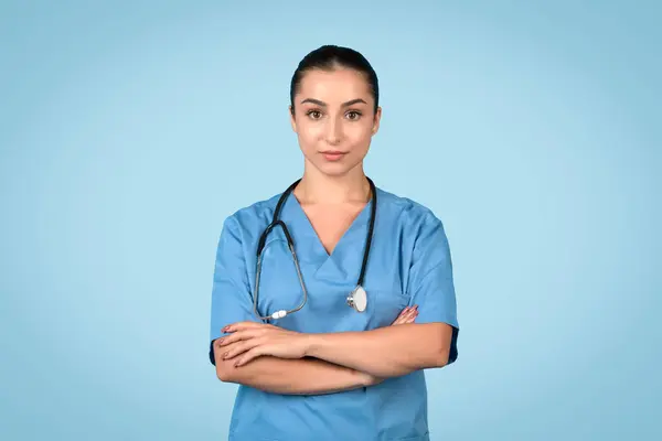 Competent Young Female Nurse Arms Crossed Wearing Blue Scrubs Stethoscope — Stock Photo, Image