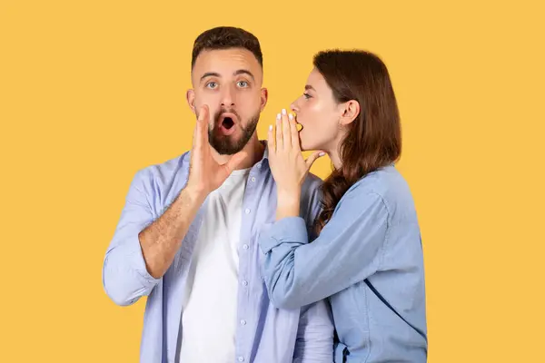 Surprised Man Listens Open Mouth Woman Whispers His Ear Both — Stock Photo, Image