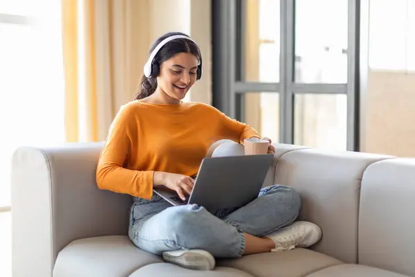 Smiling Indian Woman Comfortably Working Her Laptop While Listening Music — Stock Photo, Image