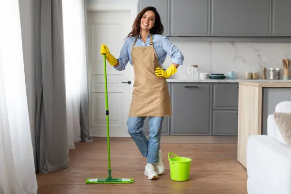 Cheerful Woman Blue Shirt Apron Yellow Gloves Stands Mop Next — Stock Photo, Image
