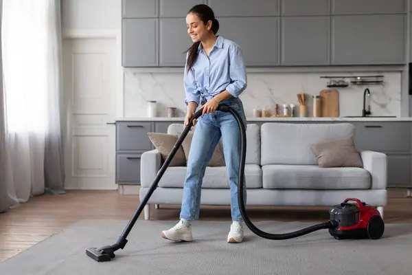 Focused Diligent Young Woman Vacuums Living Room Carpet Wielding Modern — Stock Photo, Image