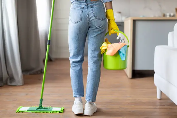 Unrecognizable Woman Casual Attire Diligently Mopping Wooden Floor Holding Bucket — Stock Photo, Image