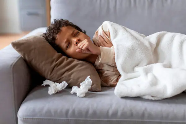 Sick Black Boy Feeling Unwell Home Coughing Fist While Lying — Stock Photo, Image
