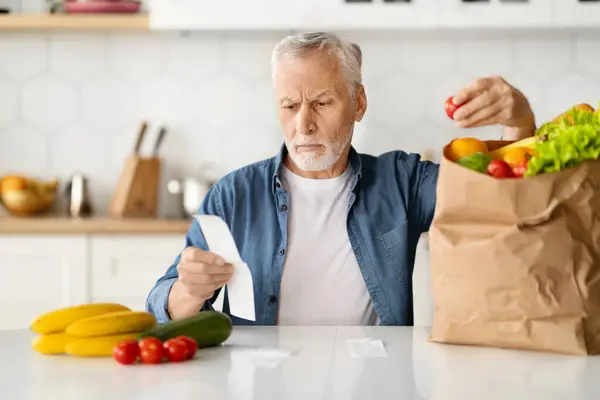 Serious Senior Man Checking Bill Examining Groceries Food Shopping Pensive — Stock Photo, Image