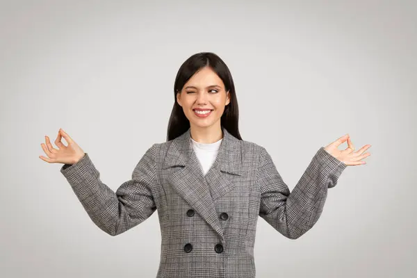 Smiling Businesswoman Checkered Blazer Practicing Meditation Peaceful Expression Embodying Calmness — Stock Photo, Image