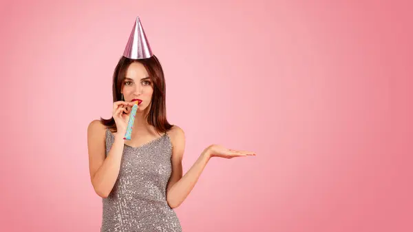 Playful Woman Sparkling Dress Party Hat Blowing Party Horn Hand — Stock Photo, Image