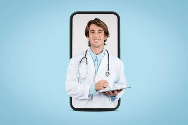 stock image Smiling male doctor holding digital tablet is framed within smartphone screen, symbolizing telehealth and online medical consultation