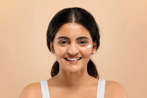 Skin Care Young Indian Woman Dab Facial Cream Her Cheek — Stock Photo, Image
