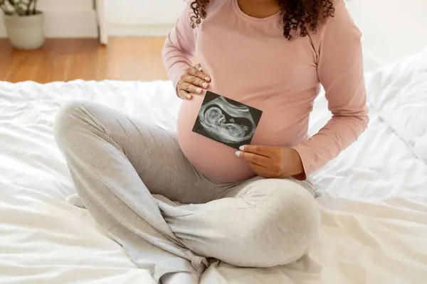 Unrecognizable Black Pregnant Woman Showing Her Baby Sonography Photo While — Stock Photo, Image