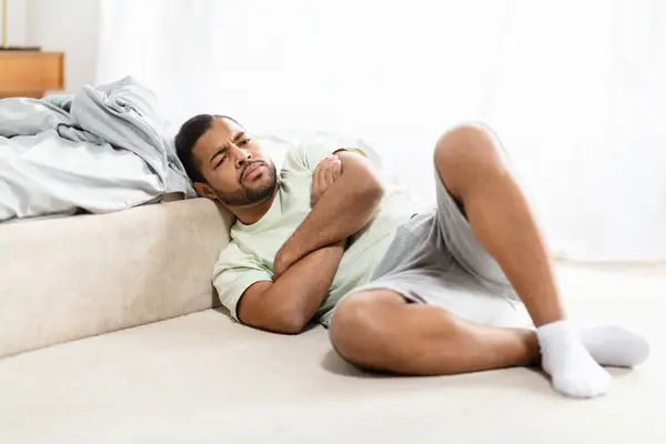 Devastated Handsome Bearded Millennial African American Guy Wearing Pajamas Laying — Stock Photo, Image