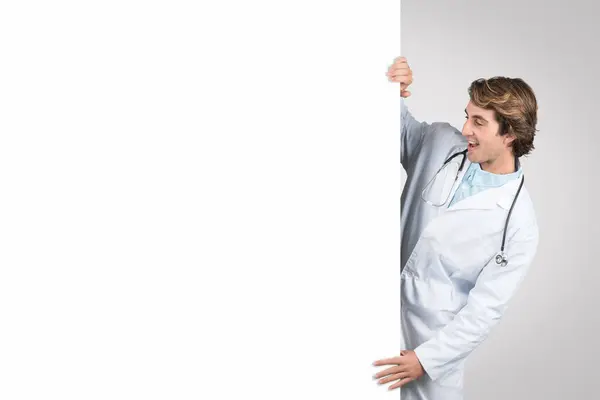 Cheerful Male Doctor White Coat Stethoscope Holding Looking Large Blank — Stock Photo, Image