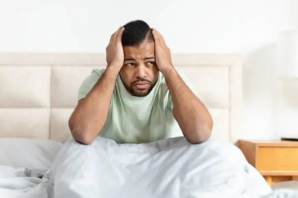 Upset African American Man Suffering Headache Stress While Sitting Bed — Stock Photo, Image
