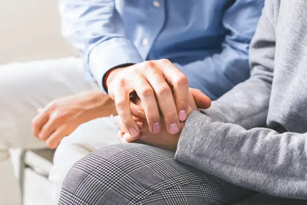 stock image Closeup of unrecognizable man comforting his wife, holding her hands, giving psychological support, apologising, crop