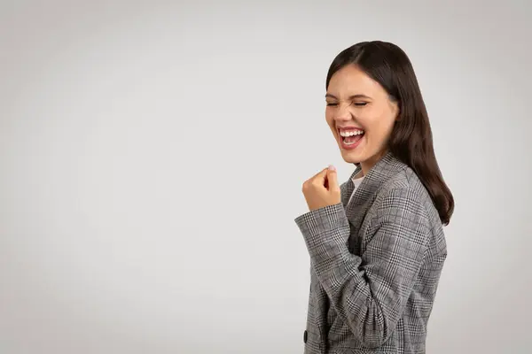 Delighted Young Woman Classic Houndstooth Jacket Fist Pumped Celebration Laughing — Stock Photo, Image