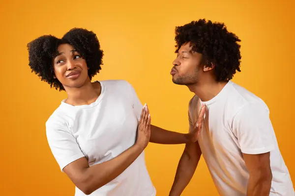 Friendzone Concept Disgusted Black Woman Avoiding Unwanted Kiss Obsessed Man —  Fotos de Stock