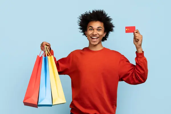 Exuberant African American Man Holding Colorful Shopping Bags Credit Card — Stock Photo, Image