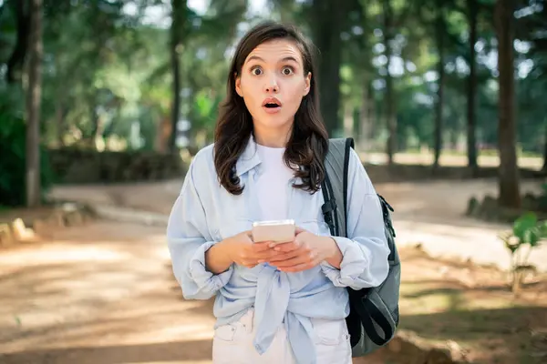 Shocked Young Woman Student Reacts Surprising Message Her Phone Outdoors — Stock Photo, Image