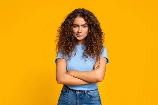 Woman Curly Hair Looking Doubtful Arms Crossed Yellow Background Looking — Stock Photo, Image