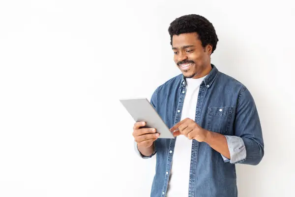 Content Black Man Denim Shirt Engaging Digital Tablet Cheerful Young — Stock Photo, Image