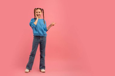 A cheerful young girl with braided hair, wearing casual clothes, flashes a peace sign against a solid pink backdrop clipart
