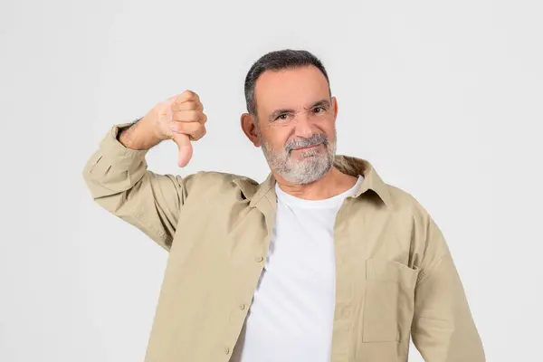 Disgruntled Older Man Beard Giving Thumbs Sign Signifying Disapproval Dissatisfaction — Stock Photo, Image