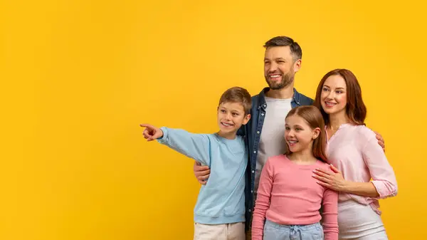 Four Family Members Pointing Delightedly Side Indicating Excitement Curiosity Copy — Stock Photo, Image