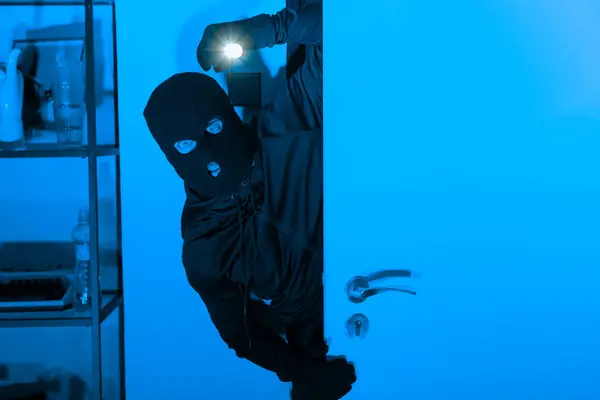 Ominous Burglar Ski Mask Stealthily Opens Door Flashlight Suggesting Break — Stock Photo, Image
