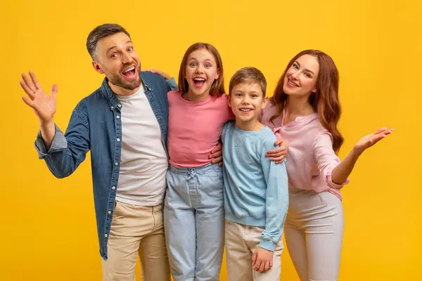 Playful Family Top Cheerful Expressions Bright Yellow Background Fun Portrait — Stock Photo, Image