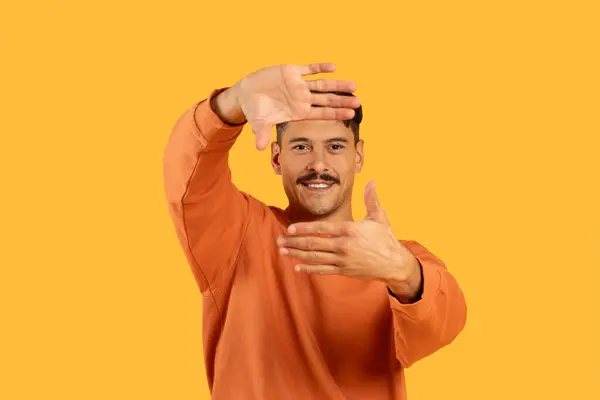 Man Moustache Orange Sweater Framing His Face Hands Vivid Yellow — Stock Photo, Image