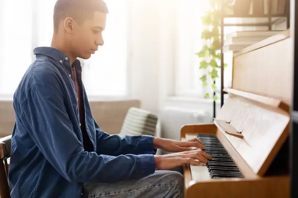 Casually Dressed Young Adult Male Practices Upright Piano Sunlit Cozy — Stock Photo, Image