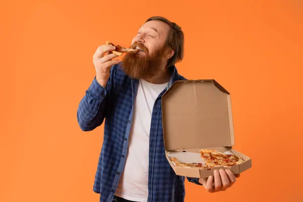 Caucasian Redhaired Bearded Man Biting Pizza Slice Appetite While Holding — Stock Photo, Image