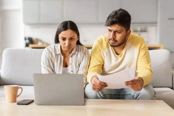 Concerned Indian Millennial Couple Appears Carefully Scrutinize Home Finances Documents — Stock Photo, Image