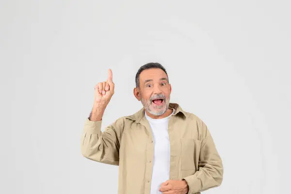 Old Man Shows Excitement Pointing Enthusiastically Isolated Neutral Background Copy — Stockfoto