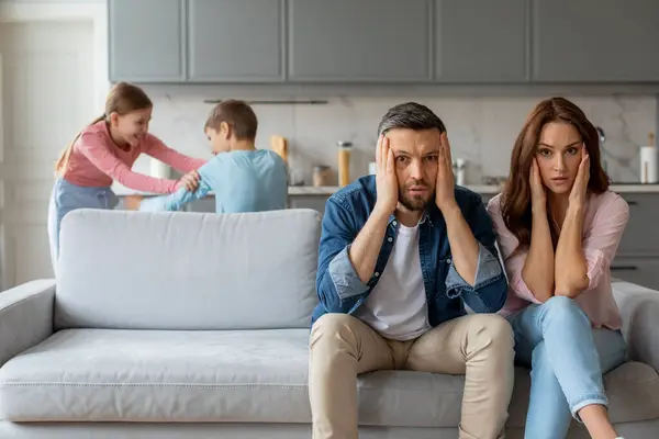 European Family Exhibits Mix Love Affection Stress Overwhelmed Parents Sit — Stock Photo, Image