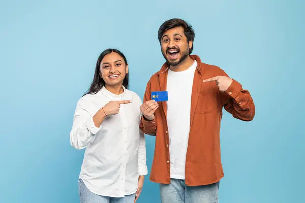 Smiling Indian Couple Holding Pointing Credit Card Suggesting Shopping Financial — Stock Photo, Image