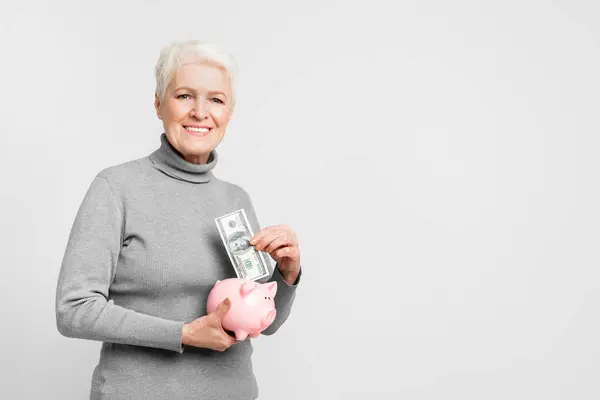 Optimistic Senior European Woman Piggy Bank Illustrating Financial Prudence Saving — Stock Photo, Image