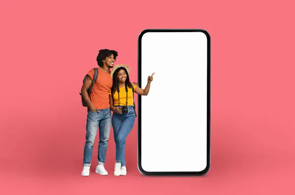 Dynamic Young Black Couple Pointing Empty Smartphone Display Set Pink — Stock Photo, Image