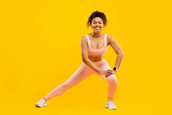 African American Lady Beaming Smile Performing Lateral Stretches Promoting Fitness — Stock Photo, Image