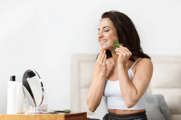 Smiling Millennial Lady Enjoying Skincare Routine Jade Rollers Bright Bathroom — Stock Photo, Image