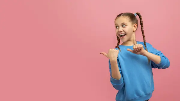Cheerful Young Girl Braided Hair Smiling Pointing Copy Space Thumbs — Stock Photo, Image